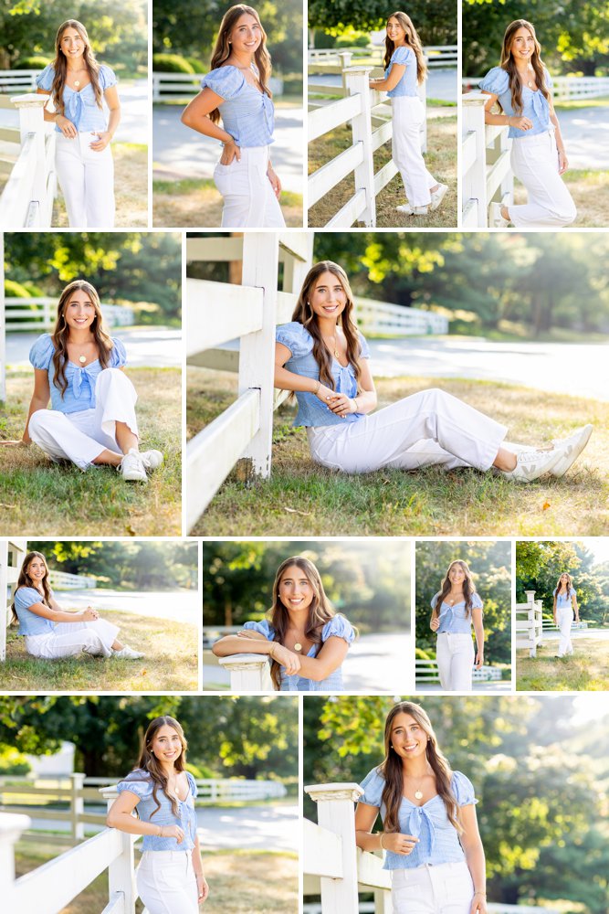 Senior girl in white jeans and pretty blue top walking along a fence in downtown Lynnfield
